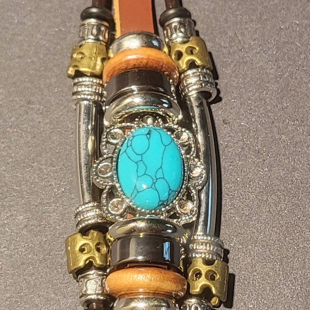 Turquoise and leather bracelet....24101
